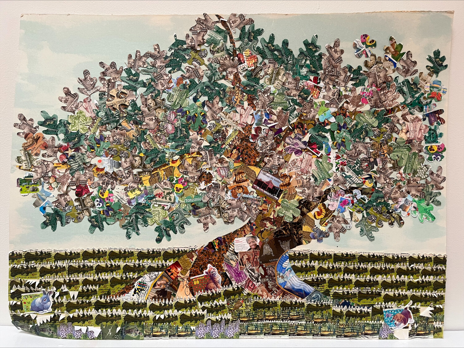 This Tree of Life original stamps collage was designed by Jamie Droste and completed by charter school staff members in celebration of the Holocaust Stamps Project’s completion.